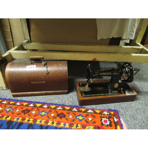 71 - Antique Singer sewing machine in case.