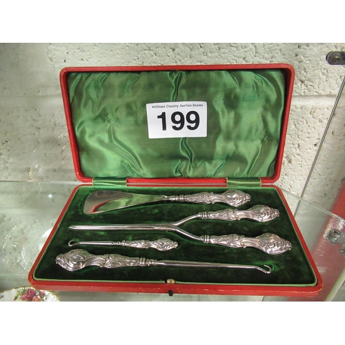 199 - Solid silver handles dressing set in a velvet presentation case.