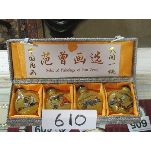 610 - 4 Chinese scent/snuff bottles in case and signed.