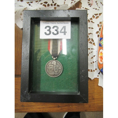 334 - Framed German medal.