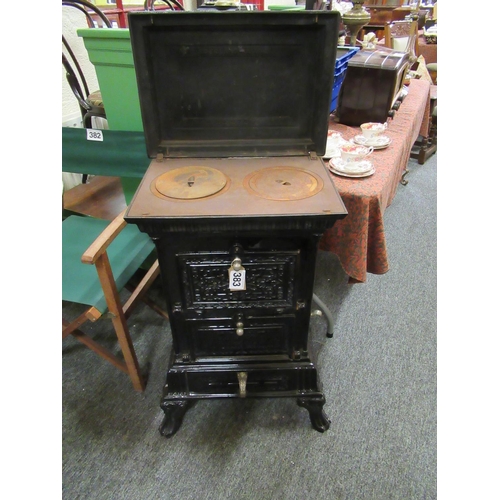 383 - Good French cast iron stove with cooking facilities.  H:90cm, W:52cm, D:38cm.