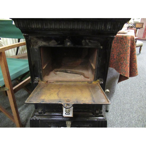 383 - Good French cast iron stove with cooking facilities.  H:90cm, W:52cm, D:38cm.