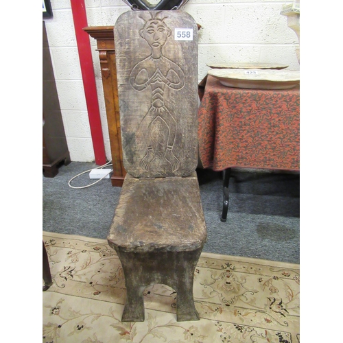 558 - Carved African folding chair.