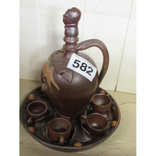 582 - Caluados - Decanter and 6 cups on tray.