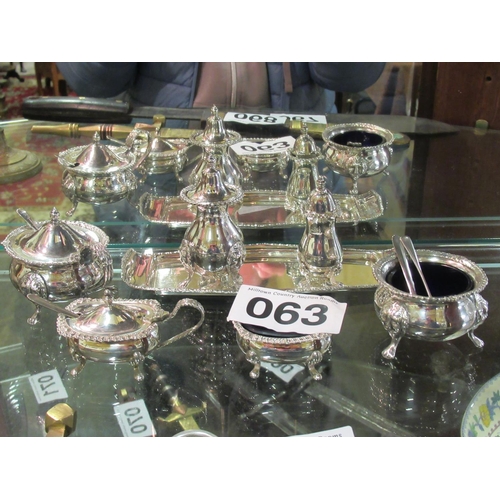 63 - Silver plated cruet set.