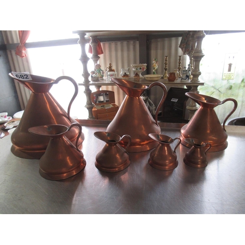 682 - Set of 7 copper jugs.