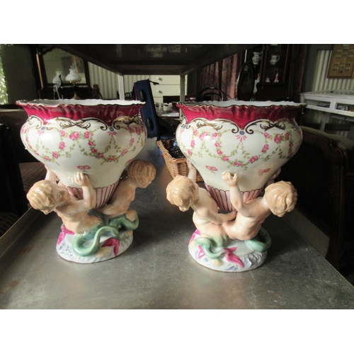 683 - Pair of French porcelain Cherub vases.