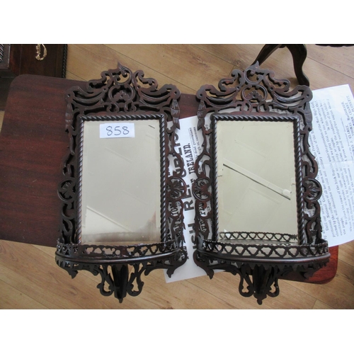 858 - Pair of victorian beveled edge hall mirrrors with shelf and gallery rail.