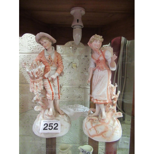 252 - Pair of 17th century Chelsea figurines.  H: 34cm.