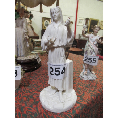 254 - Figurine.  H:23cm