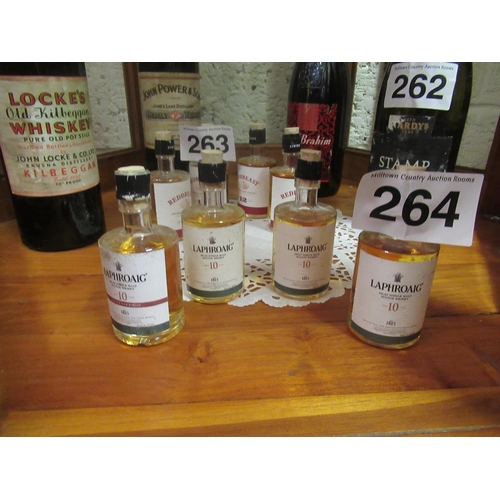 264 - 4 Small bottles of Laphroaig Whiskey. 10cm