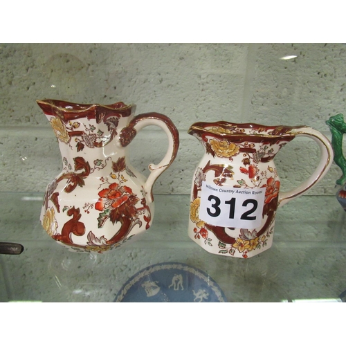 312 - 2 Brown Velvet masons Jugs. Tallest H: 14cm.