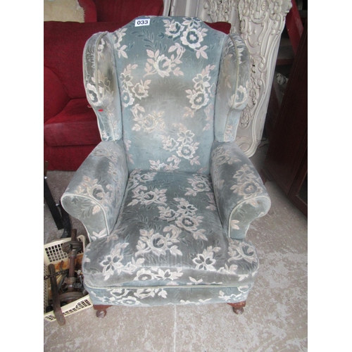 33 - Good wing back armchair.