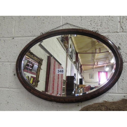 348 - Victorian mahogany oval bevelled mirror in mahogany frame.  80cm x 55cm.