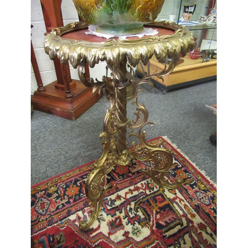 395 - Brass circular table on brass pod.  H:75cm, Top diameter:40cm.