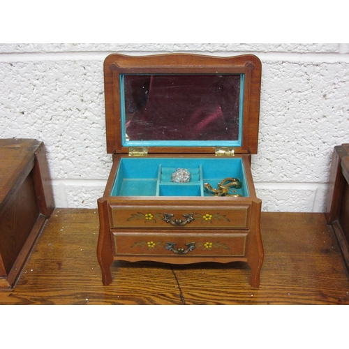 78 - Mahogany musical jewellery casket.  H:17cm x W:24cm, x D:16cm