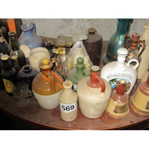 569 - Large Collection of Bottles and Whiskey Jugs