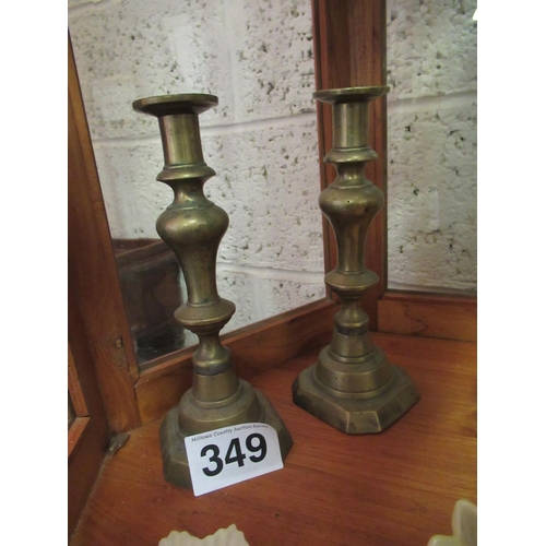 349 - Pair of brass candle sticks.  H:25cm