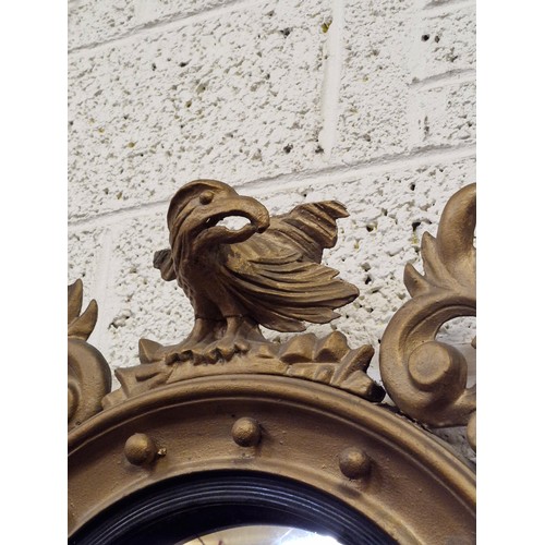 210 - Gilt frame Convex wall mirror depicting Eagle.  H:79cm x 55cm.