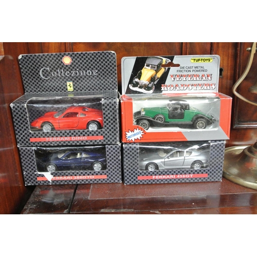 108 - A collection of 4 model cars in original packaging.