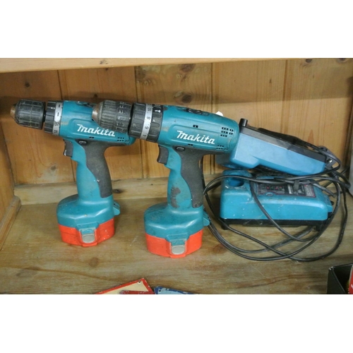 388 - 2 Makita drills with chargers.