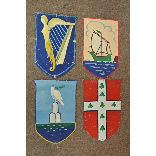 389 - A collection of 4 handmade double sided tin shields, each side with hand painted design. Each shield... 