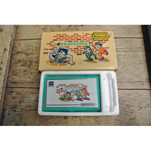 395 - An original vintage Nintendo Game & Watch 'Bomb Sweeper' game, complete with original box.