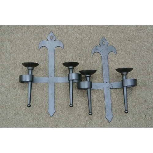 418 - A pair of wrought iron wall sconces.