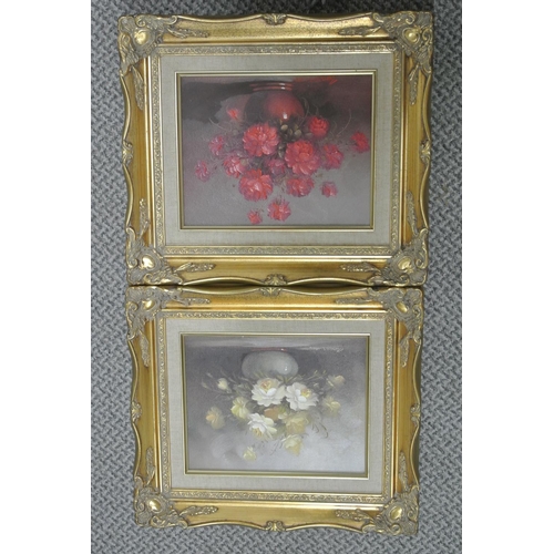 143 - A pair of framed oil on board still life studies of flowers.

Untitled.

Each piece measures 39x34cm... 