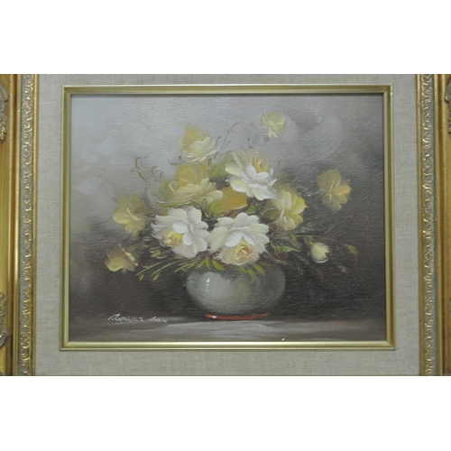 143 - A pair of framed oil on board still life studies of flowers.

Untitled.

Each piece measures 39x34cm... 