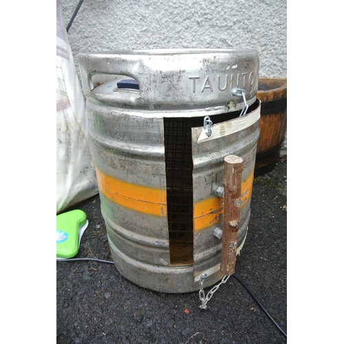 104 - A beer keg, converted to a smoker/ BBQ.