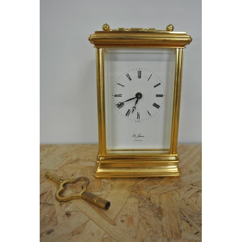 251 - A St James of London gilt cased carriage clock.