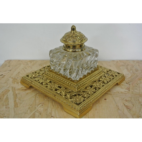 406 - An antique brass & glass desk inkwell.