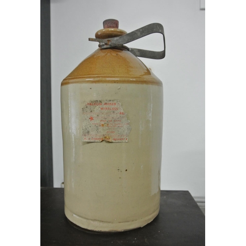 113 - An large antique stoneware bottle with a label that reads 'Falcon Amber Wireless Reagent, H.J Christ... 