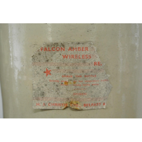 113 - An large antique stoneware bottle with a label that reads 'Falcon Amber Wireless Reagent, H.J Christ... 