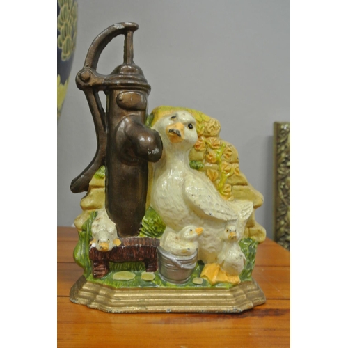 136 - A cast iron door stop showing ducks