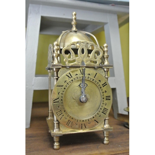 185 - An antique Smiths brass cased lantern clock.