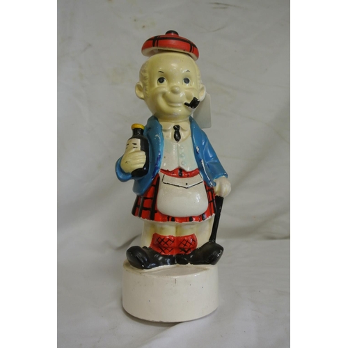 188 - A vintage Scottish Whisky musical decanter.