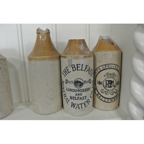 228 - A collection of 3 antique stoneware bottled to include The Belfast Mineral Water Company, Murphys Sp... 