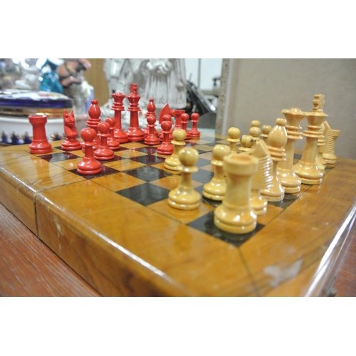 232 - A vintage wooden travel chess set.