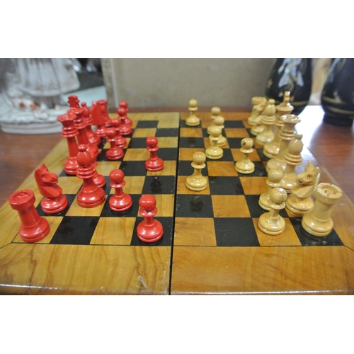 232 - A vintage wooden travel chess set.