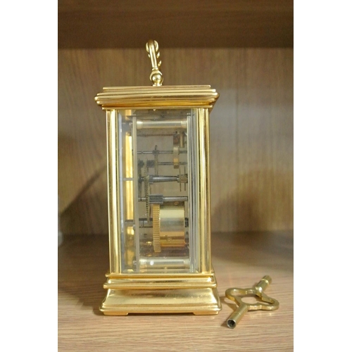 239 - A St James of London gilt cased carriage clock.