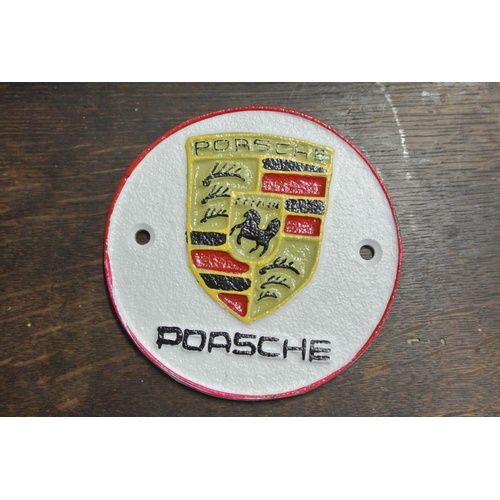 256 - A cast iron Porsche sign.