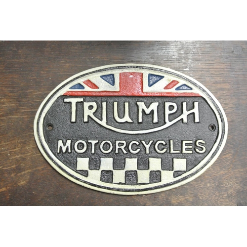 257 - A cast iron Triumph motorcycles sign.