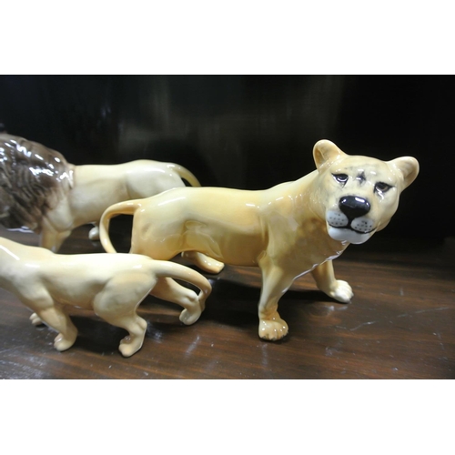 267 - A collection of vintage Beswick animals, to include Lion, Lioness & Lion cub.