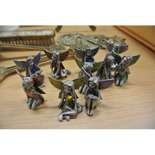 86 - A collection of small pewter angels