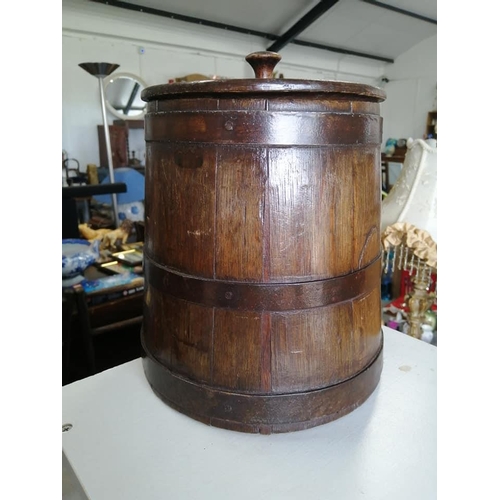 287 - An antique coopered barrel with banded steel & lid.