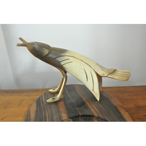 172 - A vintage novelty ashtray, with carved horn modelled as a bird mounted on wooden base with glass dis... 