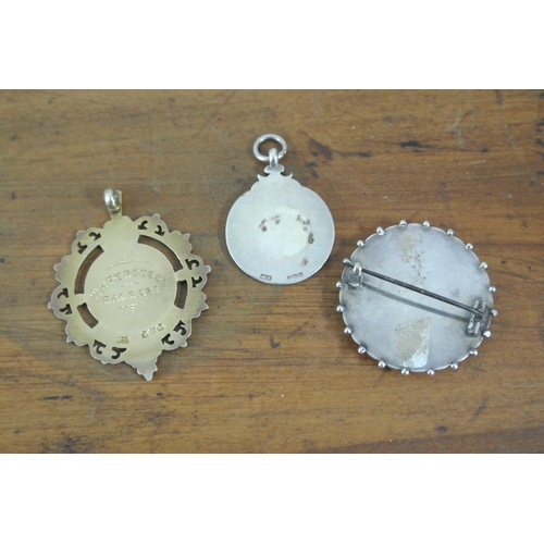 178 - A collection of 3 antique/ vintage sterling silver medals & brooches.