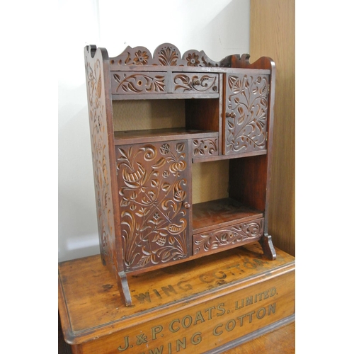 201 - A small carved cabinet/ jewellery box.